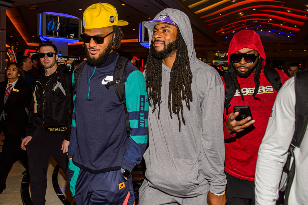 San Francisco 49ers' Fred Warner, from left, Richard Sherman and Jacob Thieneman are shown at T ...