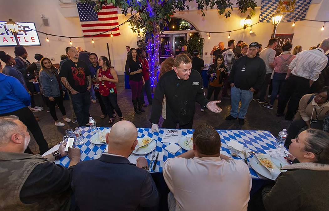 Chef David Adlard, Chef Battle Spokane winner, explains his ravioli and seared chicken dish to ...