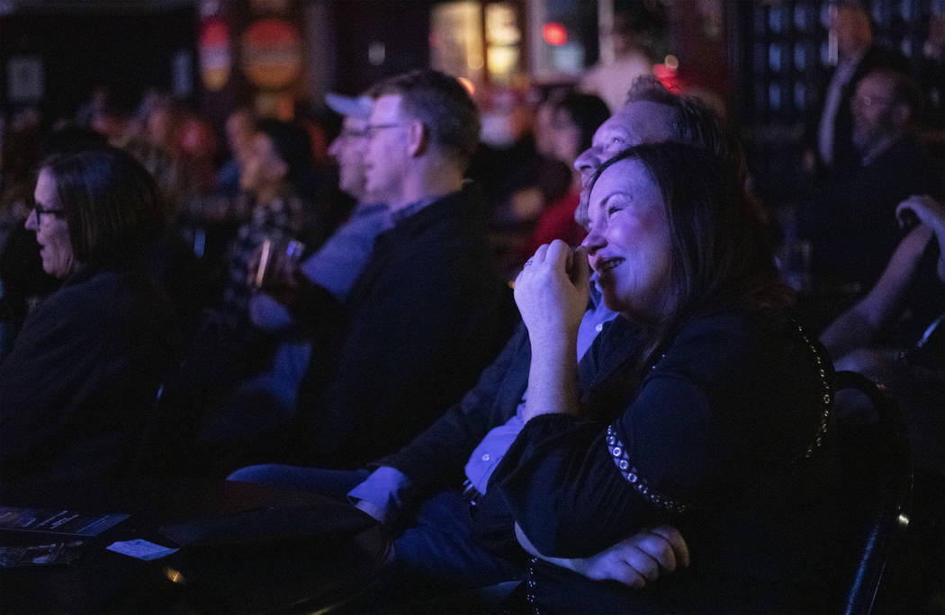 Nicole Younger and her husband Rich Younger laugh to headliner Shayma Tash at The Laugh Factory ...