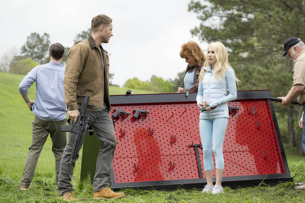 Members of the hunted (from left, Ike Barinholz, back to camera, Justin Hartley, Kate Nowlin), ...