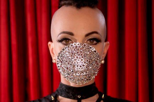 Michelle L'Amour, creator of "Quarantine Cabaret," is shown with her customized pandemic mask. ...
