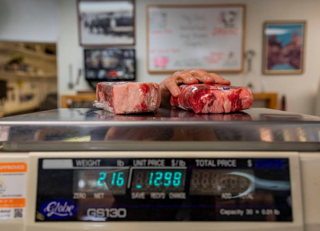 Ribeye steaks are weighed at Village Meat & Wine, an old fashioned butcher shop, in Las Veg ...