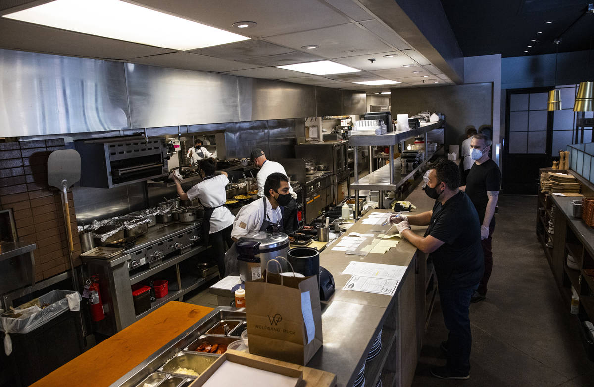 Orders are prepared at Wolfgang Puck Players Locker in Downtown Summerlin in Las Vegas on Wedne ...