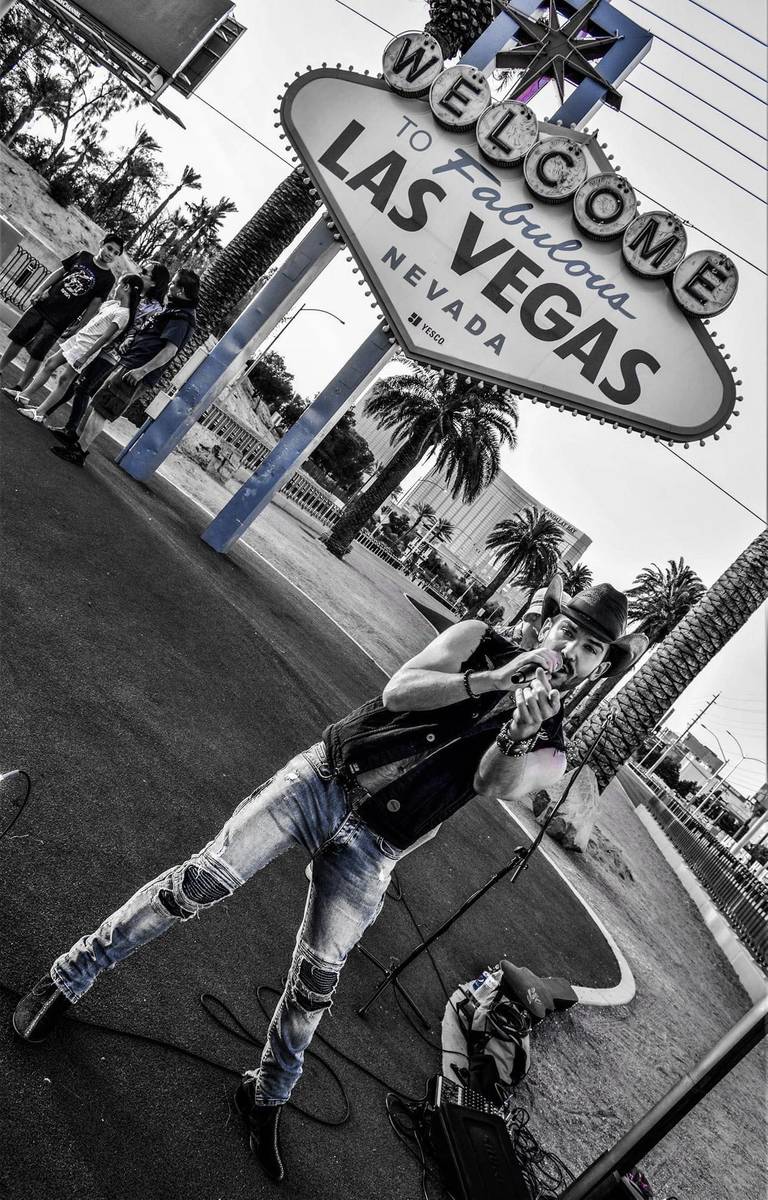 Country artist Chase Brown is shown at the Welcome to Las Vegas Sign while performing a Faceboo ...