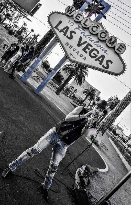Country artist Chase Brown is shown at the Welcome to Las Vegas Sign while performing a Faceboo ...