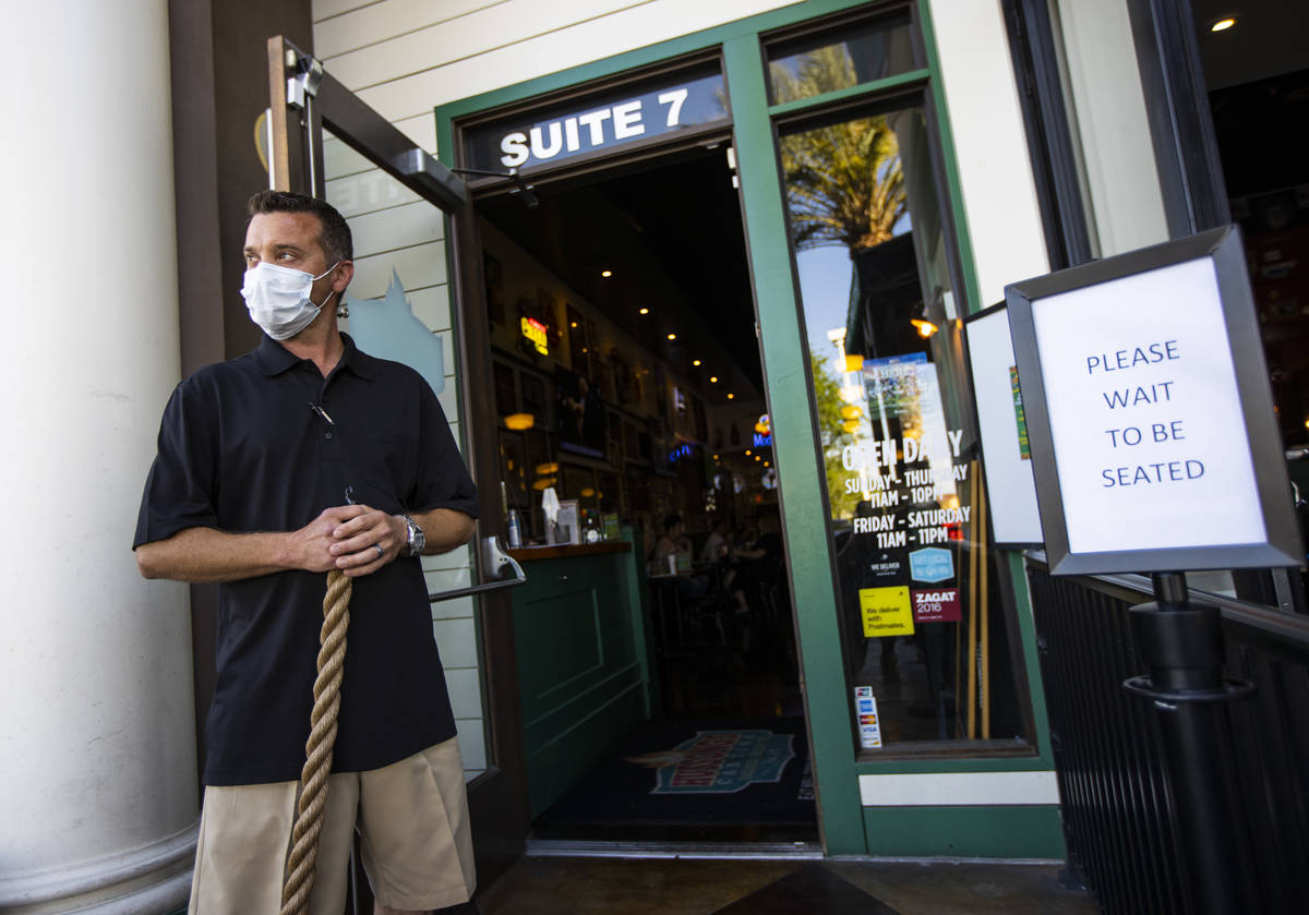 Owner Brian Mangino stands by the entrance to Hussong's Cantina in Boca Park as some restaurant ...