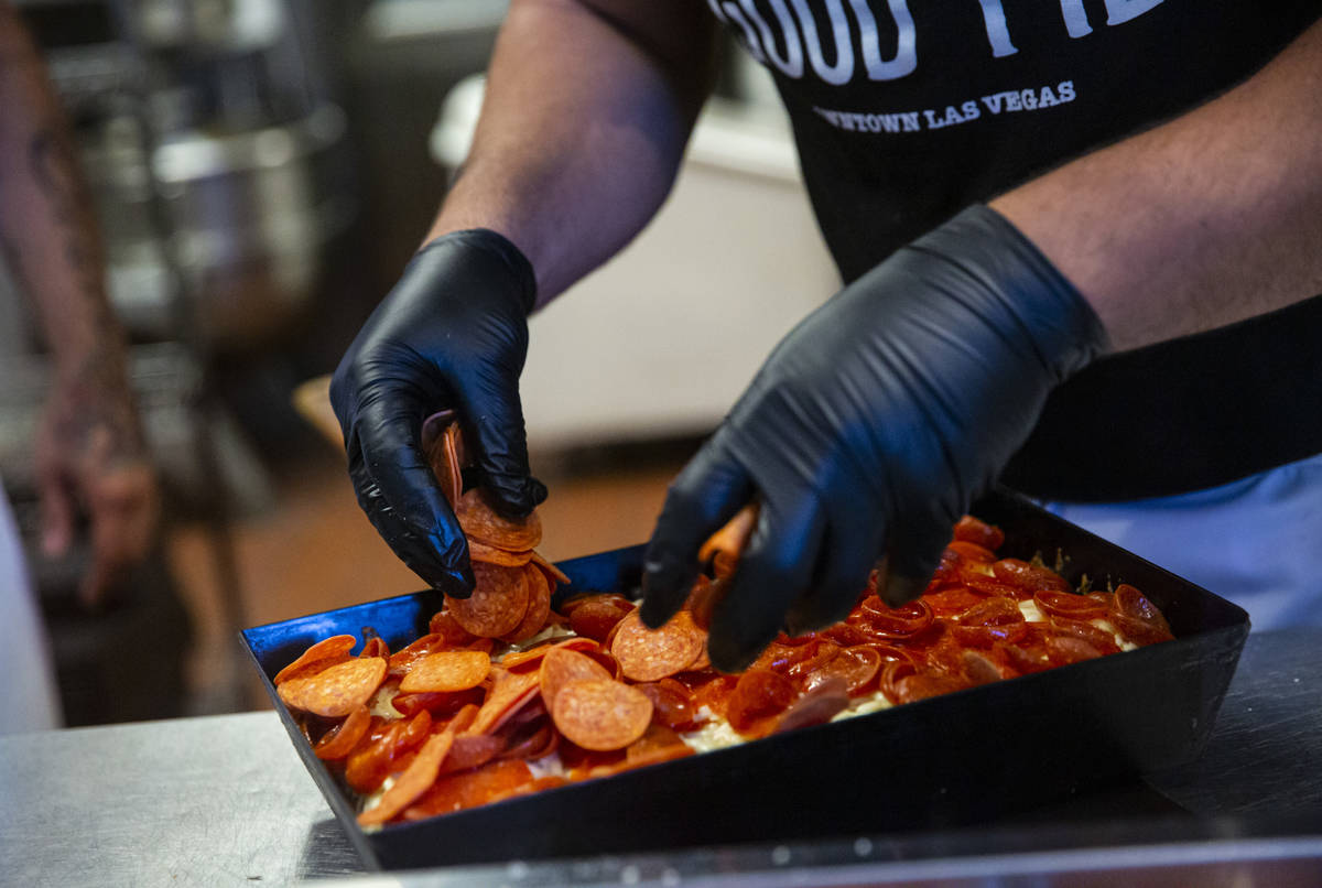 Vincent Rotolo, owner of Good Pie, prepares a triple pepperoni Detroit style pizza in downtown ...