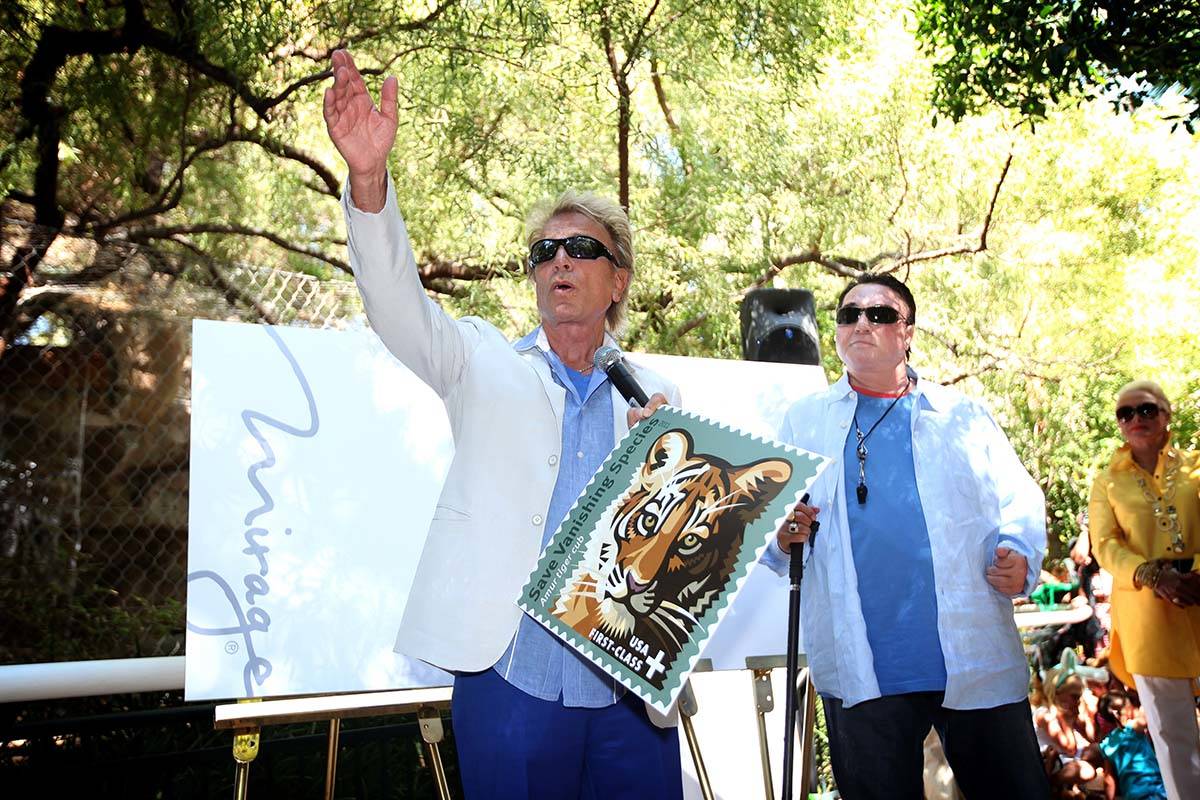 Siegfried Fischbacher, left, and Roy Horn introduce the "Save Vanishing Species" U.S. postal st ...