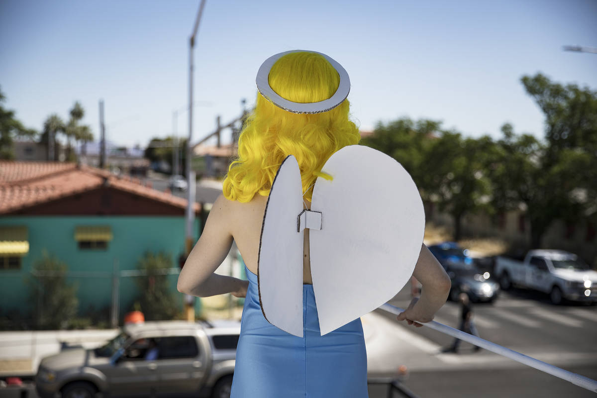Victoria Hogan, dressed as the Blue Angel statue from the former Blue Angel Motel, stands on to ...
