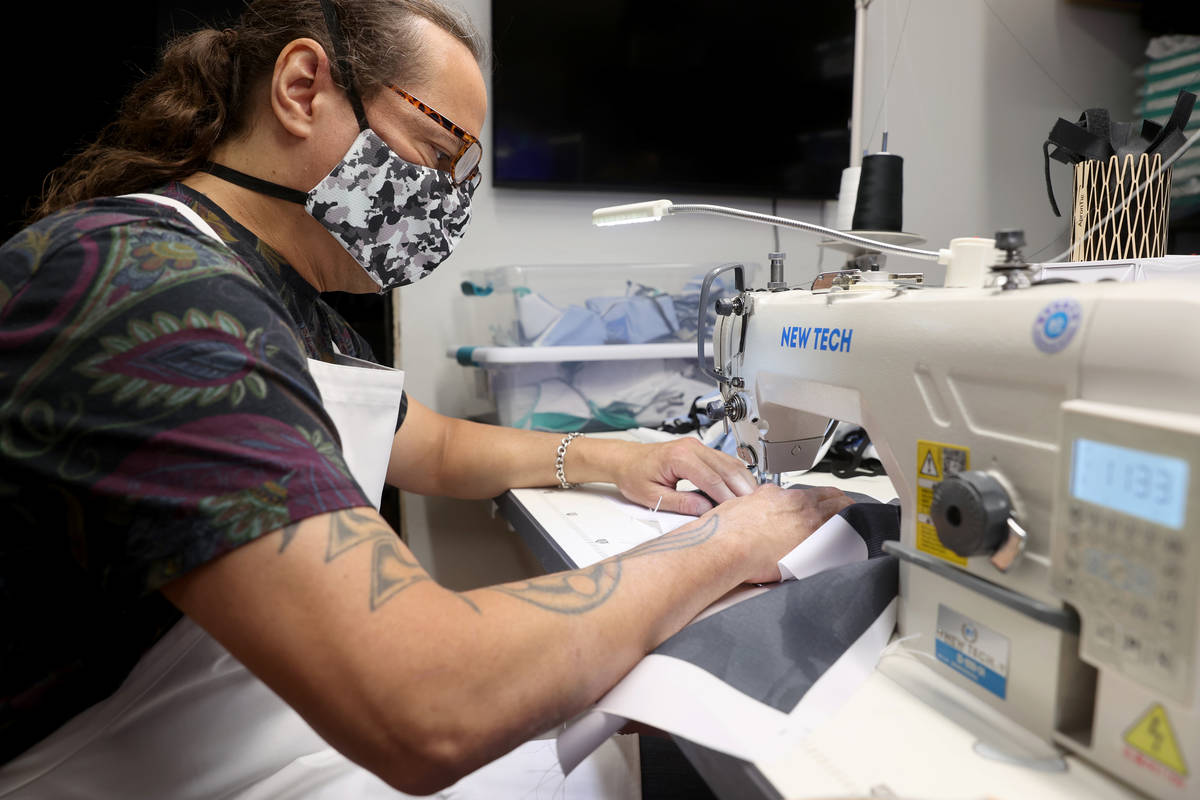 Former chef Jean Paul Labadie, creator of ApronTie, sews his product for chefs at his factory i ...