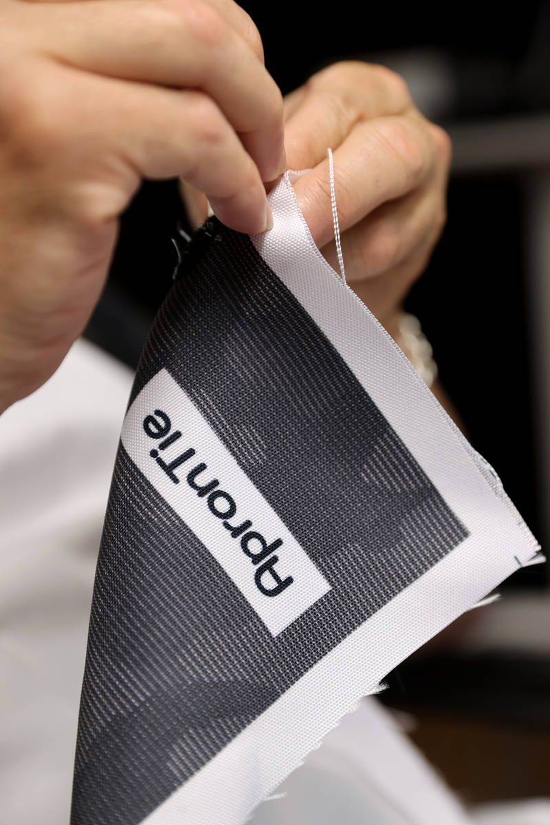 Former chef Jean Paul Labadie, creator of ApronTie, sews his product for chefs at his factory i ...