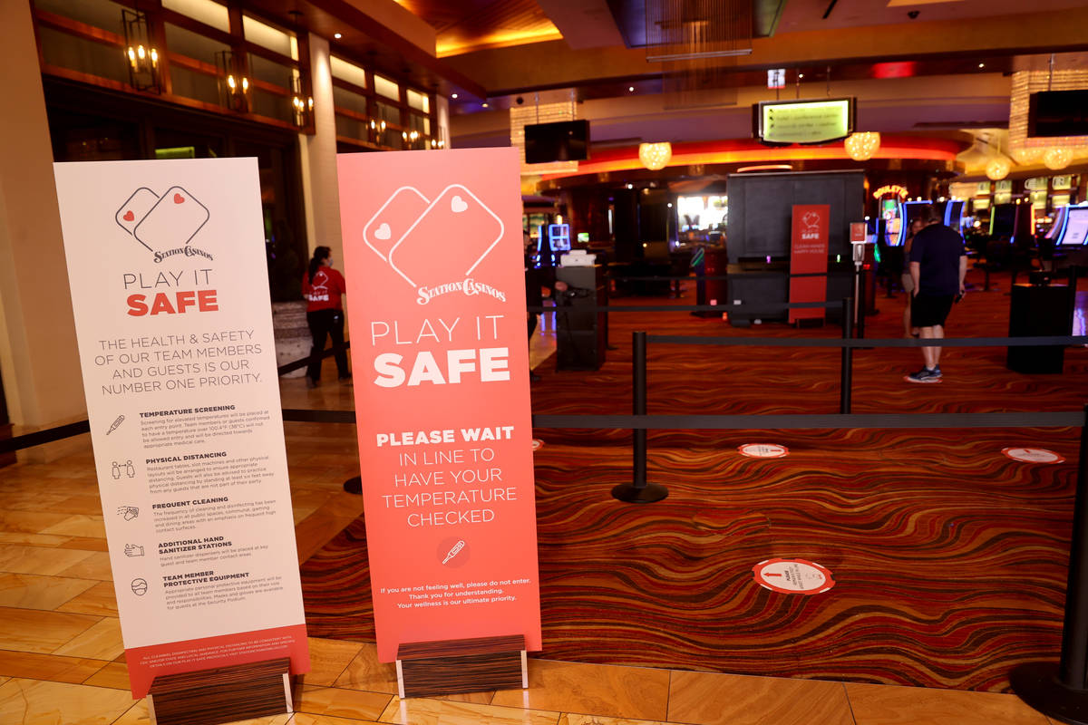 Customers line up for temperature screening at Red Rock Resort in Las Vegas Tuesday, May 26, 20 ...