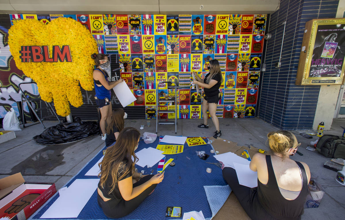 Volunteers join the experiential company Good All Day Collective as they install about 180 BLM ...