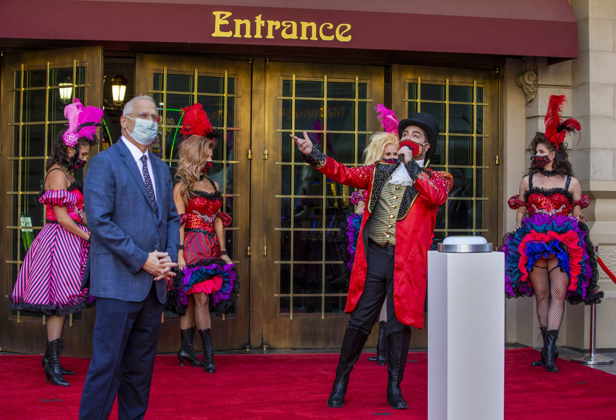 Paris Las Vegas Regional President Gary Selsner, left, looks on as a Monsieur Loyal ringmaster ...