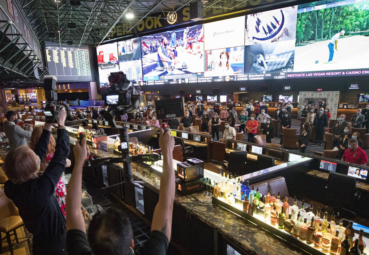 Employees gather for a photo before the reopening of the Westgate after the months long coronav ...