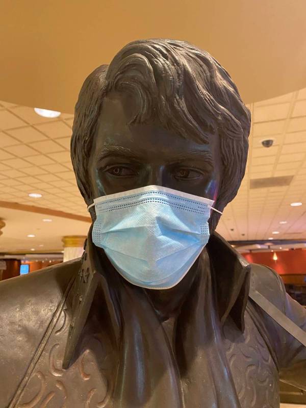 A masked statue of Elvis Presley is shown at Westgate Las Vegas on Thursday, June 18, 2020. (Jo ...