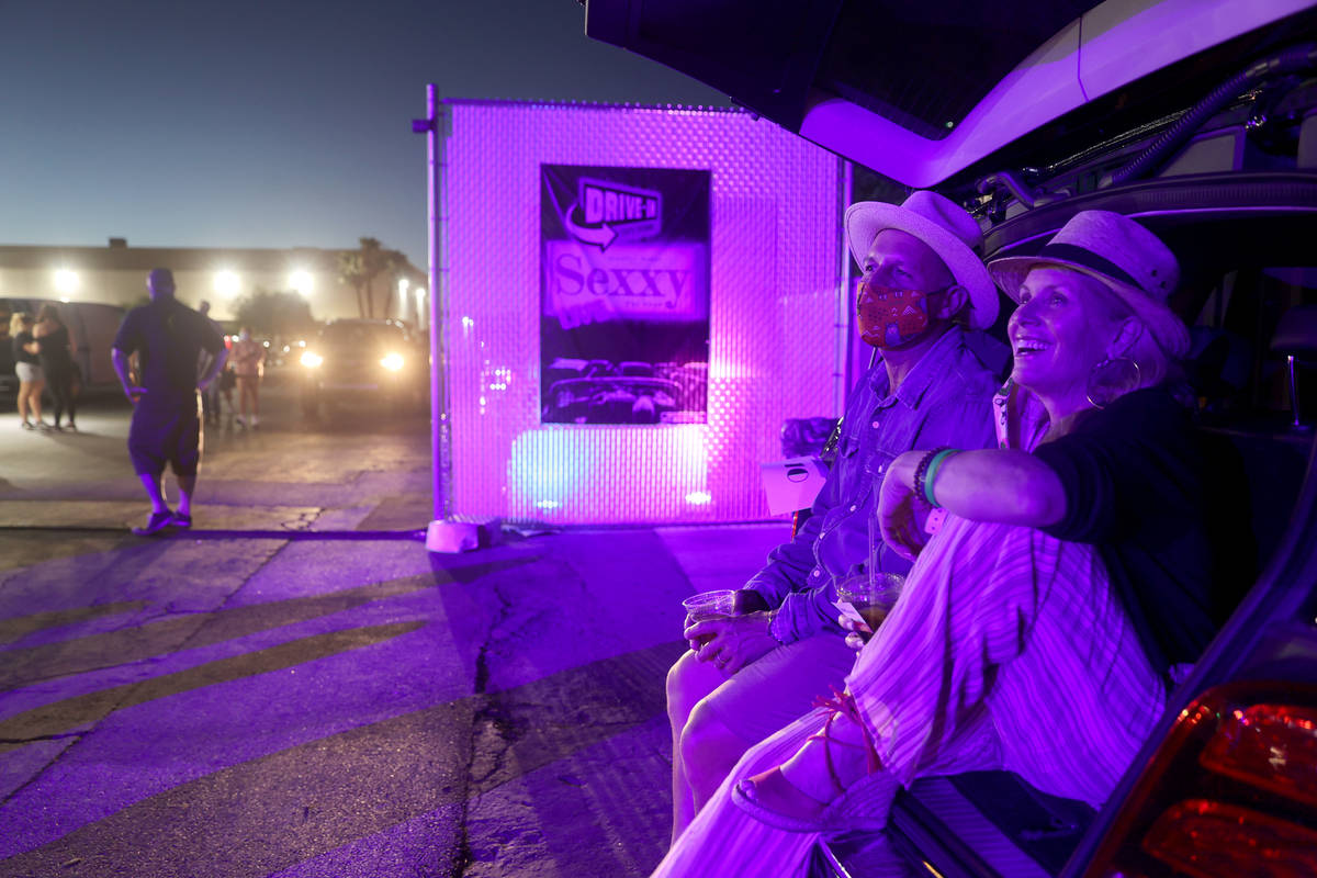 Karen Annarino and Rob Rosenow of Henderson watch the pre-show before Jennifer Romas' "Sexxy Th ...