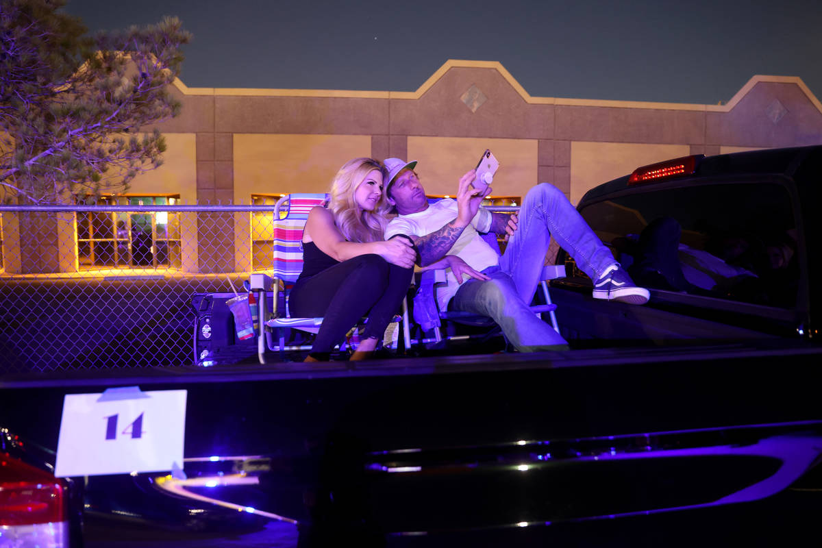 Brittney Kelley and Ryan Good of Las Vegas watch the pre-show before Jennifer Romas' "Sexxy The ...