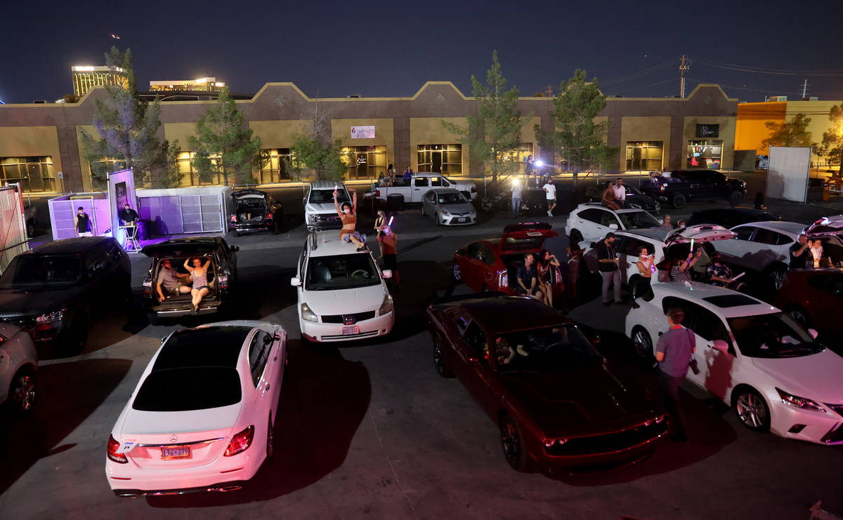 Guests watch Jennifer Romas' ÒSexxy The Show" at Dreamland Drive-In at FreshWata Stud ...
