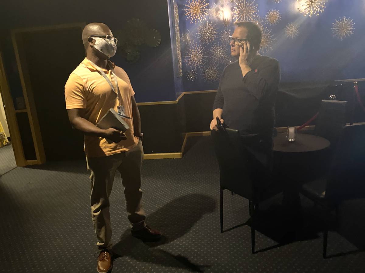 Clark County Special Agent of the Business License Enforcement Unit Drew Renter confers with De ...
