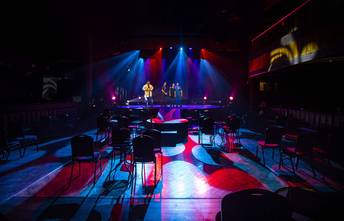 Spaced out seats are seen as Aussie Heat performers dance on the stage during a dress rehearsal ...