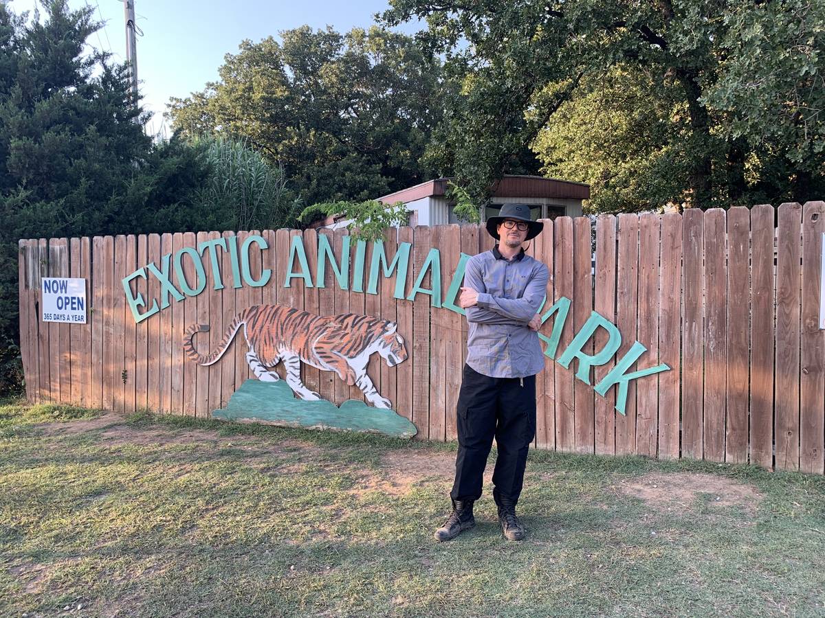 Zak Bagans is shown at the sign at the entrance Greater Wynnewood Exotic Animal Park on Saturda ...