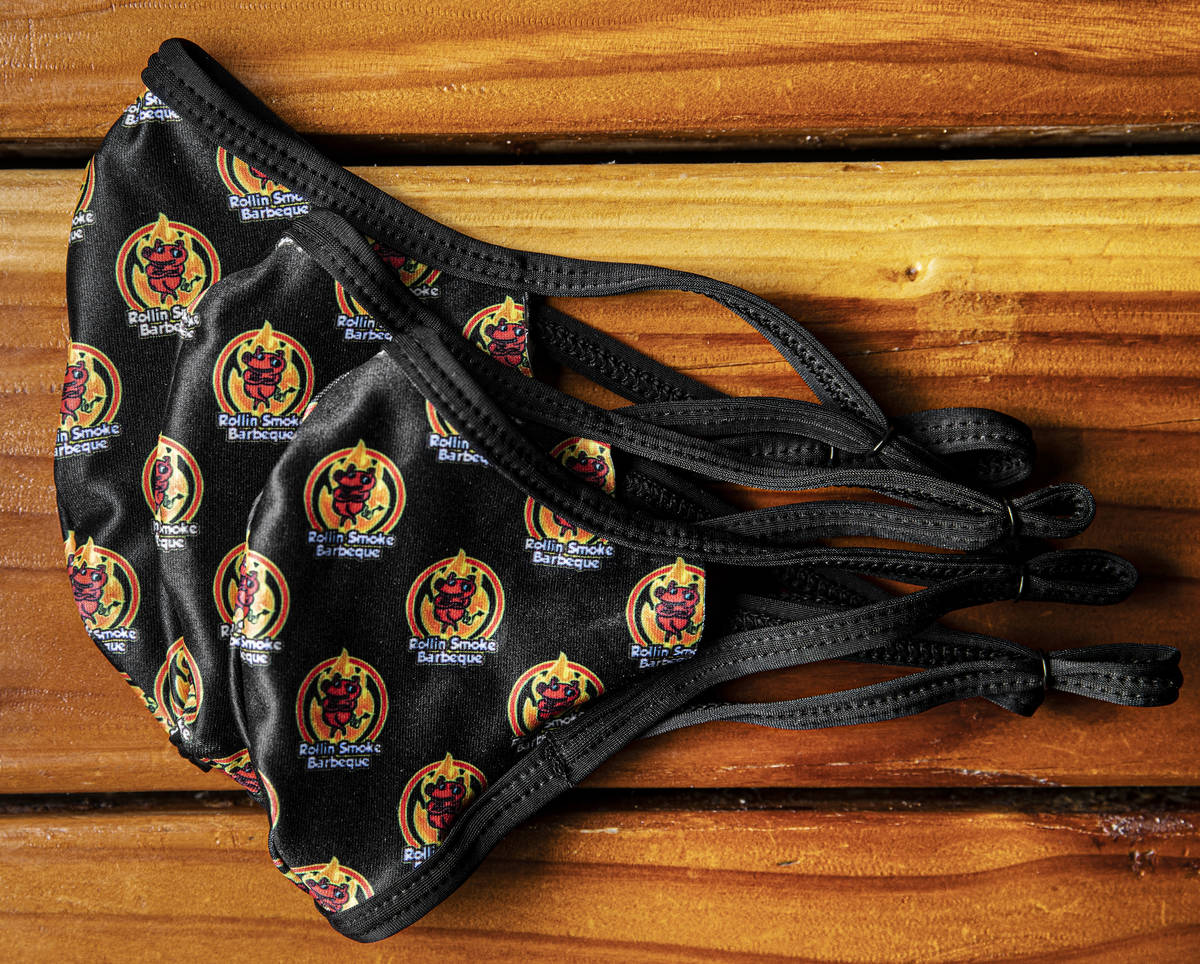 Custom face masks at Rollin' Smoke BBQ on Wednesday, July 15, 2020, in Las Vegas. (Benjamin Hag ...