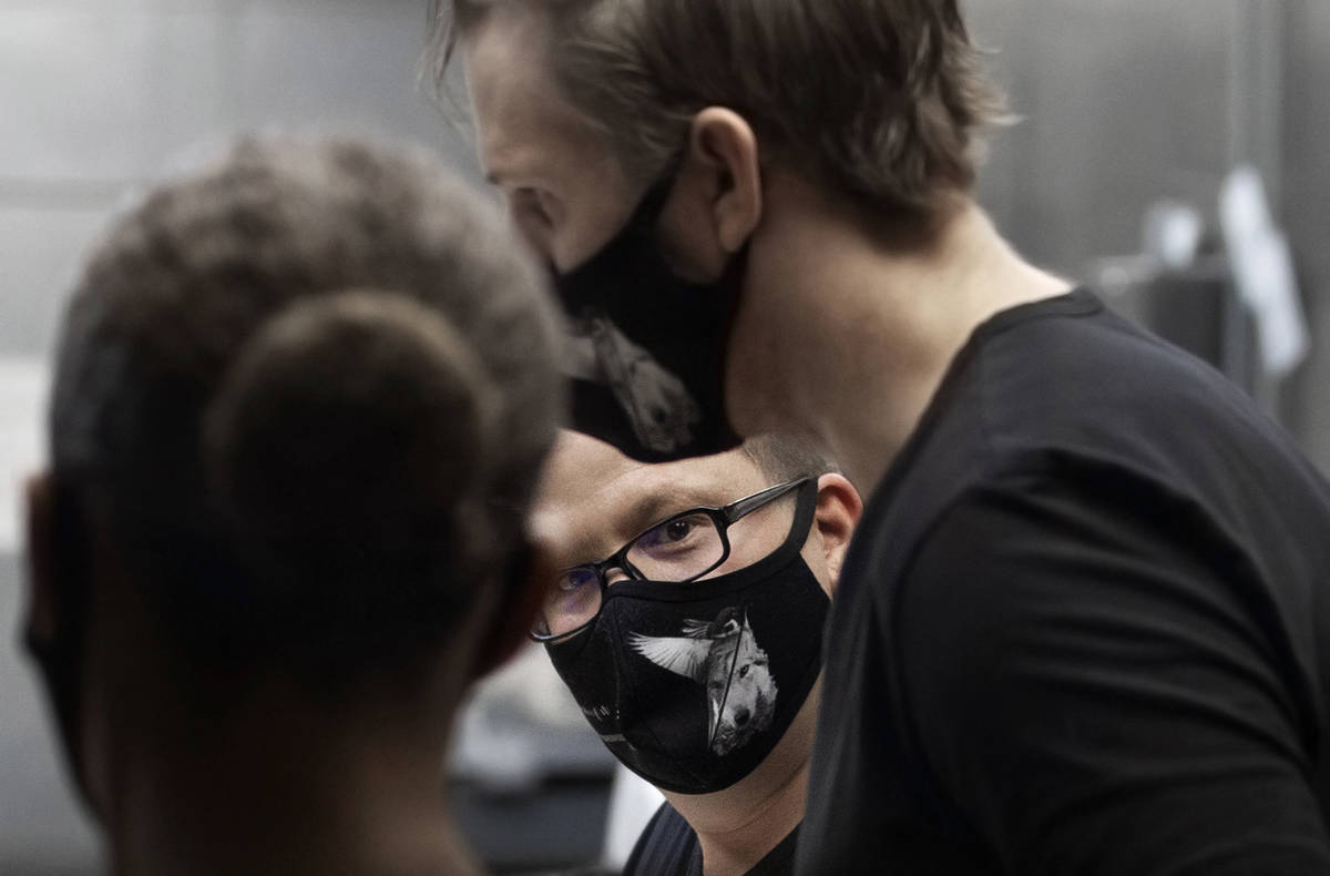 Chef/owner Brian Howard, middle, works in the kitchen wearing a custom face mask at Sparrow + W ...