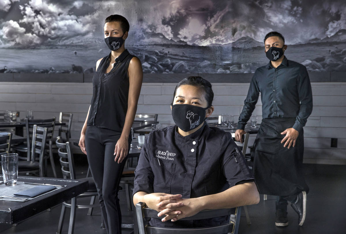 Jamie Tran, center, with Jamie Clark, left, and Jesus Ramirez from The Black Sheep wearing cust ...
