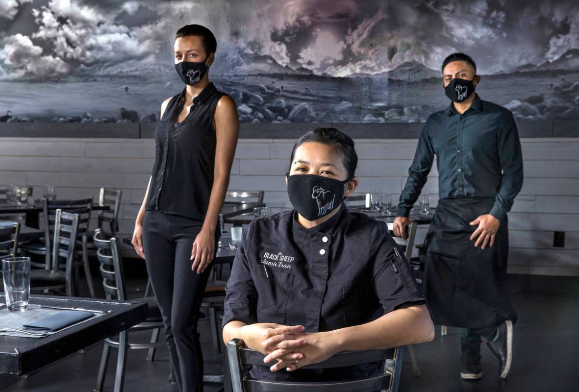 Jamie Tran, center, with Jamie Clark, left, and Jesus Ramirez from The Black Sheep wearing cust ...