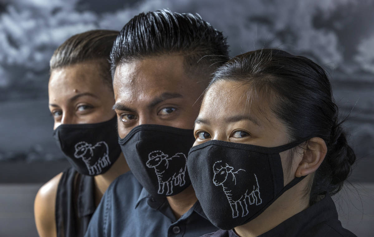 Jamie Tran, right, with Jesus Ramirez, center, and Jamie Clark from The Black Sheep wearing cus ...