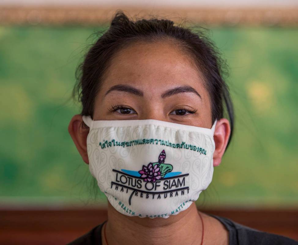 Penny Chutima at Lotus of Siam with custom mask on Wednesday, July 15, 2020, in Las Vegas. (L. ...