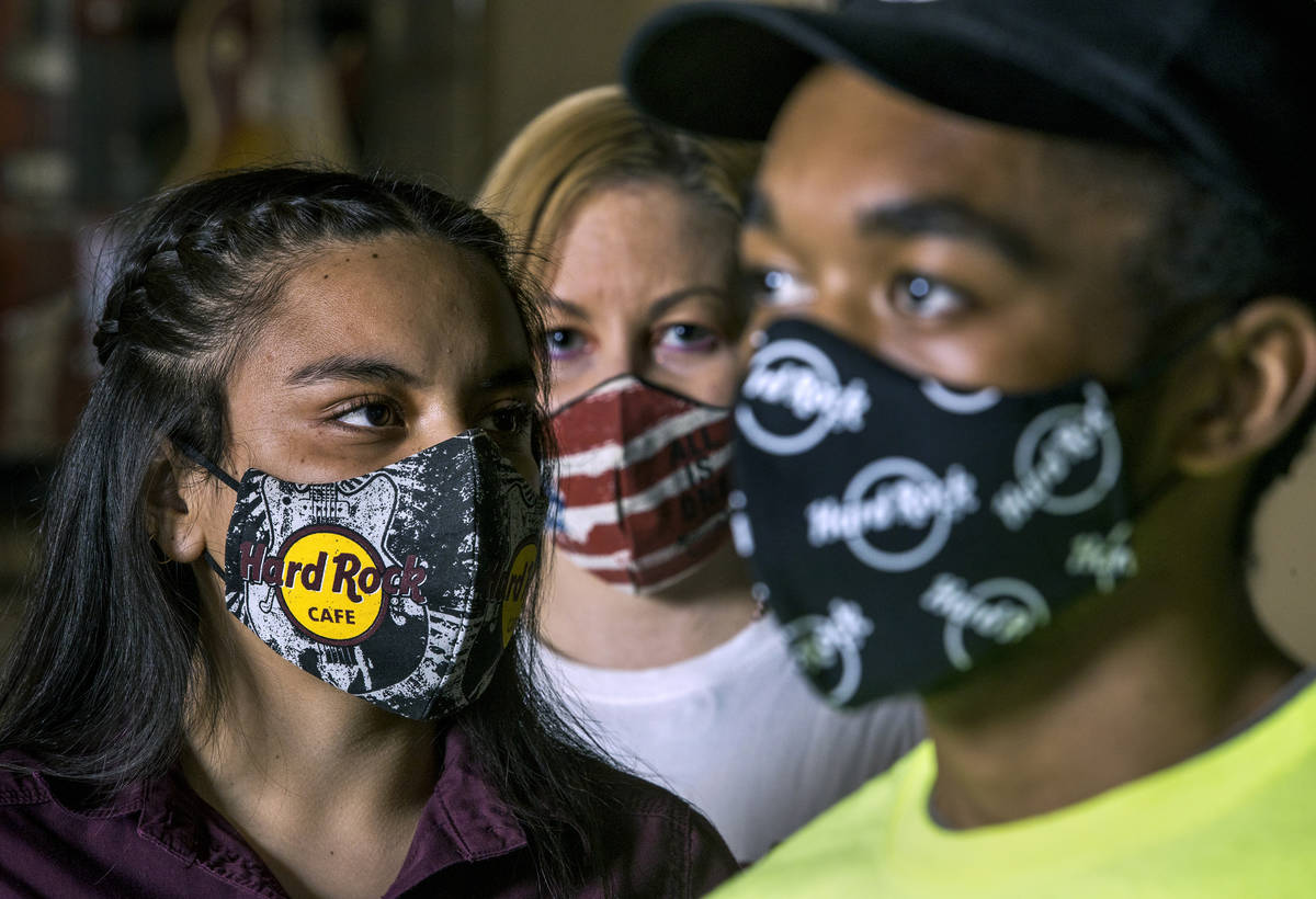 Gloria Reyes, left, Kristin McCormick, center, and Mykel Lewis at the Hard Rock Cafe wearing th ...