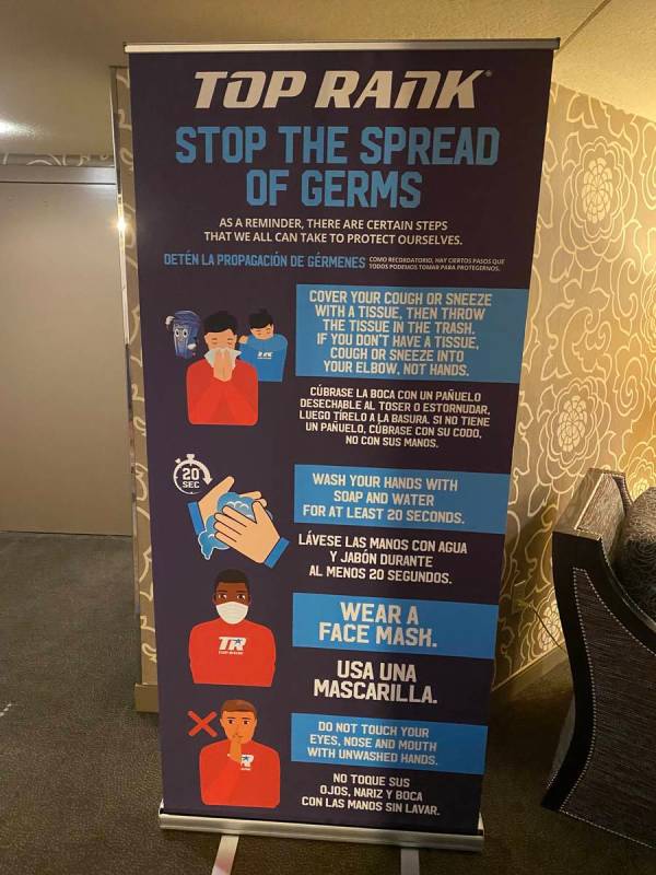 Signs are shown leading to the COVID-19 testing suite at MGM Conference Center on Monday, June ...