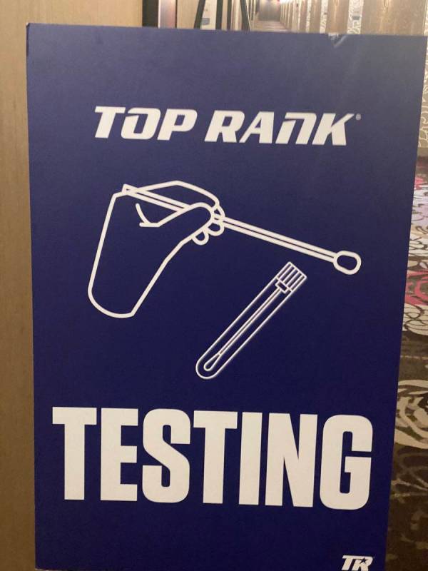 Signs are shown leading to the COVID-19 testing suite at MGM Conference Center on Monday, June ...