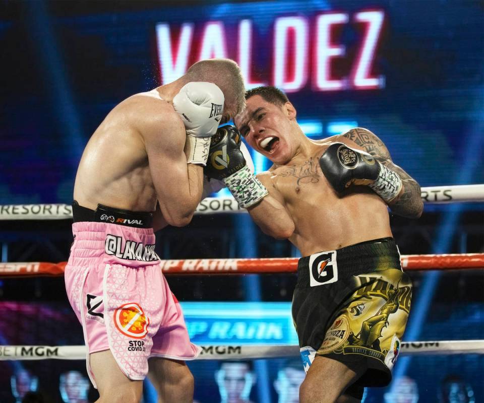 Oscar Valdez, right, lands an upper cut against Jayson Velez during their jr. lightweight fight ...