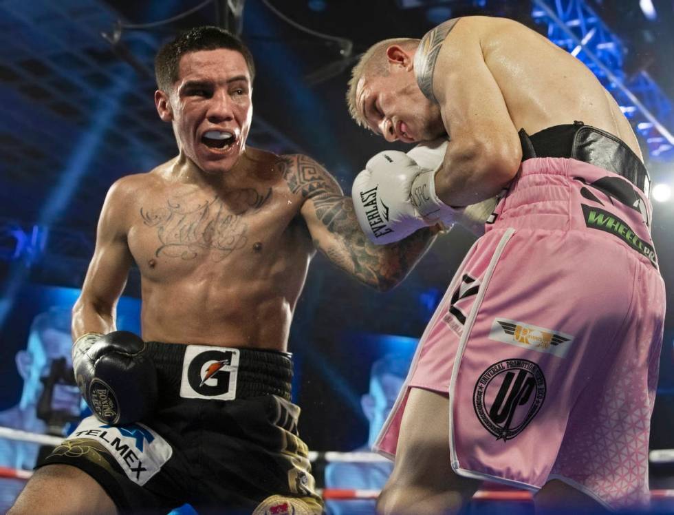 Oscar Valdez, left, lands an uppercut against Jayson Velez during their jr. lightweight fight d ...
