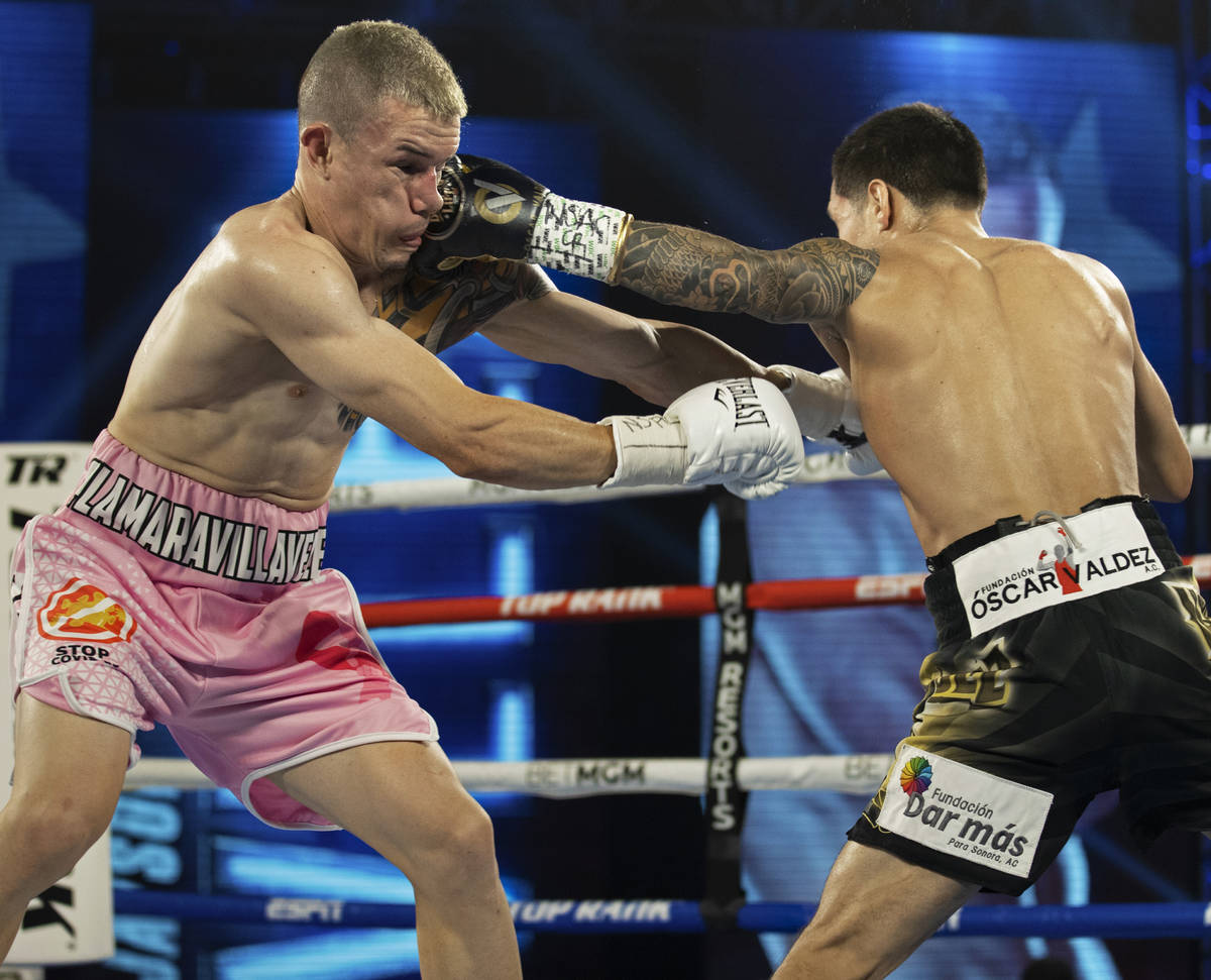 Oscar Valdez, right, lands a left hook against Jayson Velez during their jr. lightweight fight ...