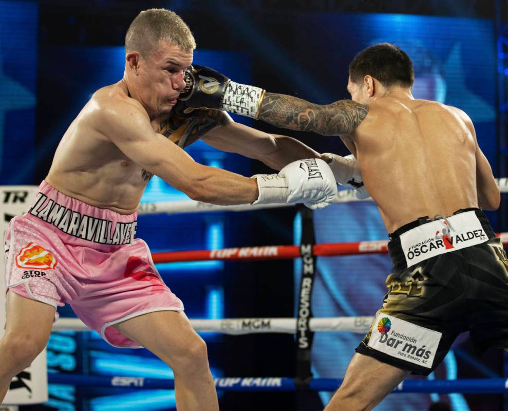 Oscar Valdez, right, lands a left hook against Jayson Velez during their jr. lightweight fight ...