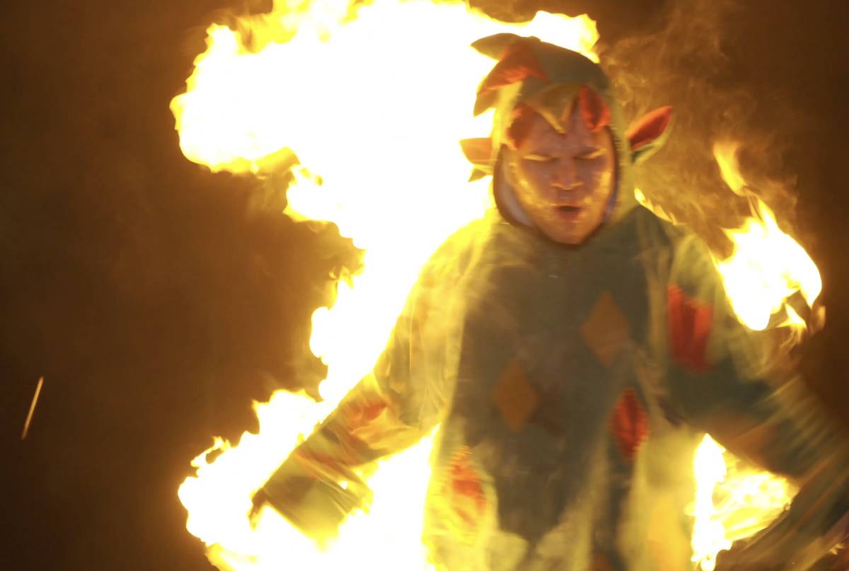 Piff the Magic Dragon attempts to escape a flaming stake in his winning "Tournament of Laughs" ...