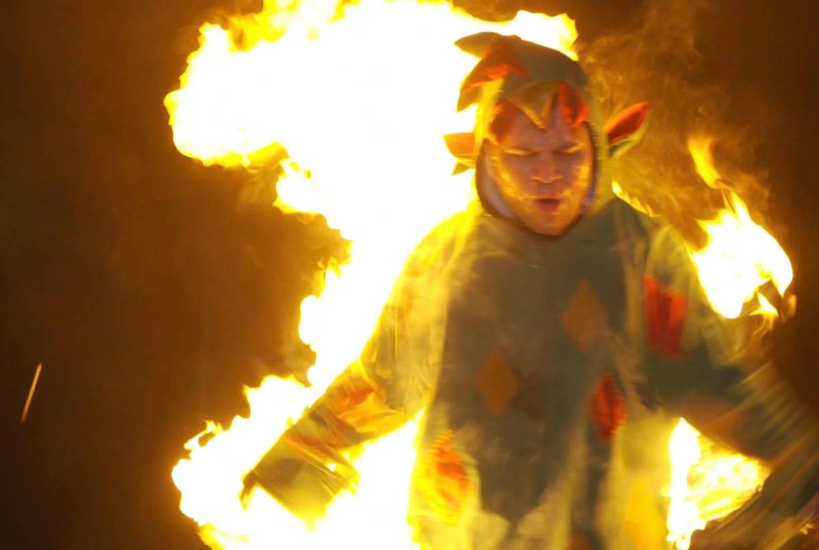 Piff the Magic Dragon attempts to escape a flaming stake in his winning "Tournament of Laughs" ...