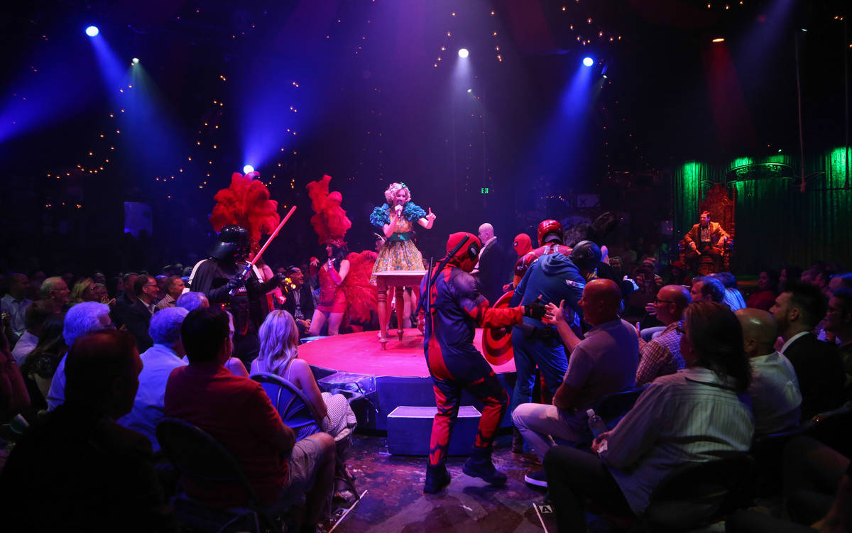 A group of buskers from the Strip join the finale of "Absinthe's" 4,000th performance at Caesar ...