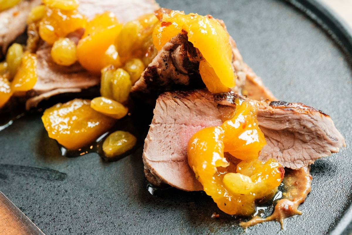 Pork tenderloin with peach chutney and apple butter mustard at Carson Kitchen. (Eugene Dela Cru ...