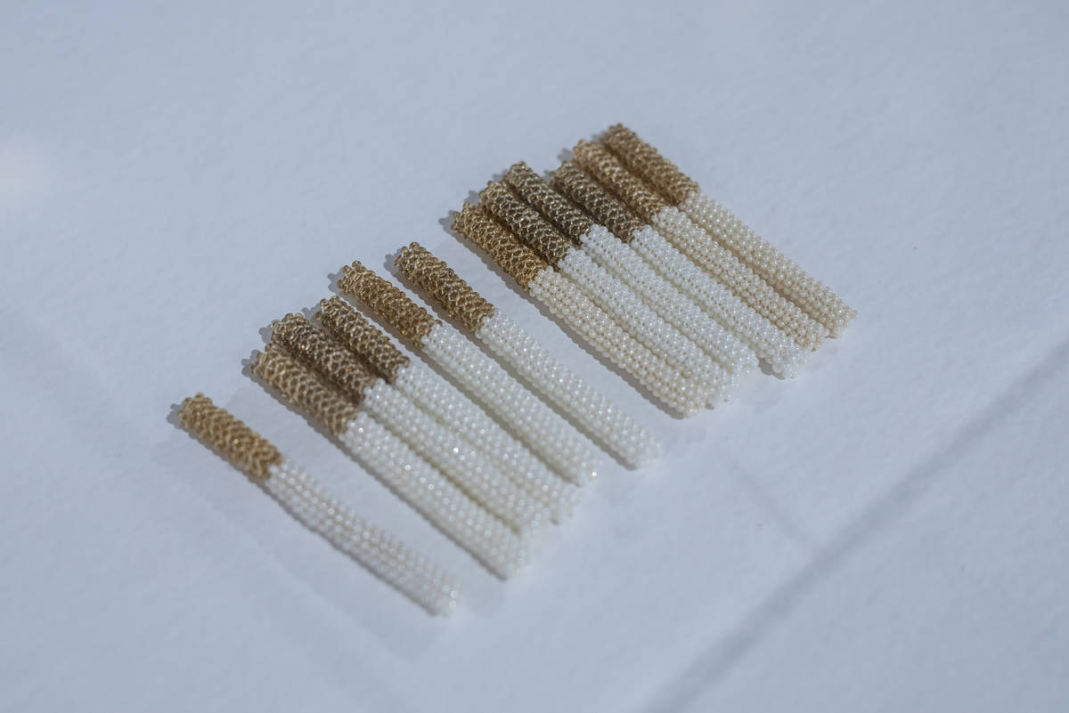 Noelle Garcia's glass beads and thread cigarettes are featured in the exhibit "Excerpts" at UNL ...