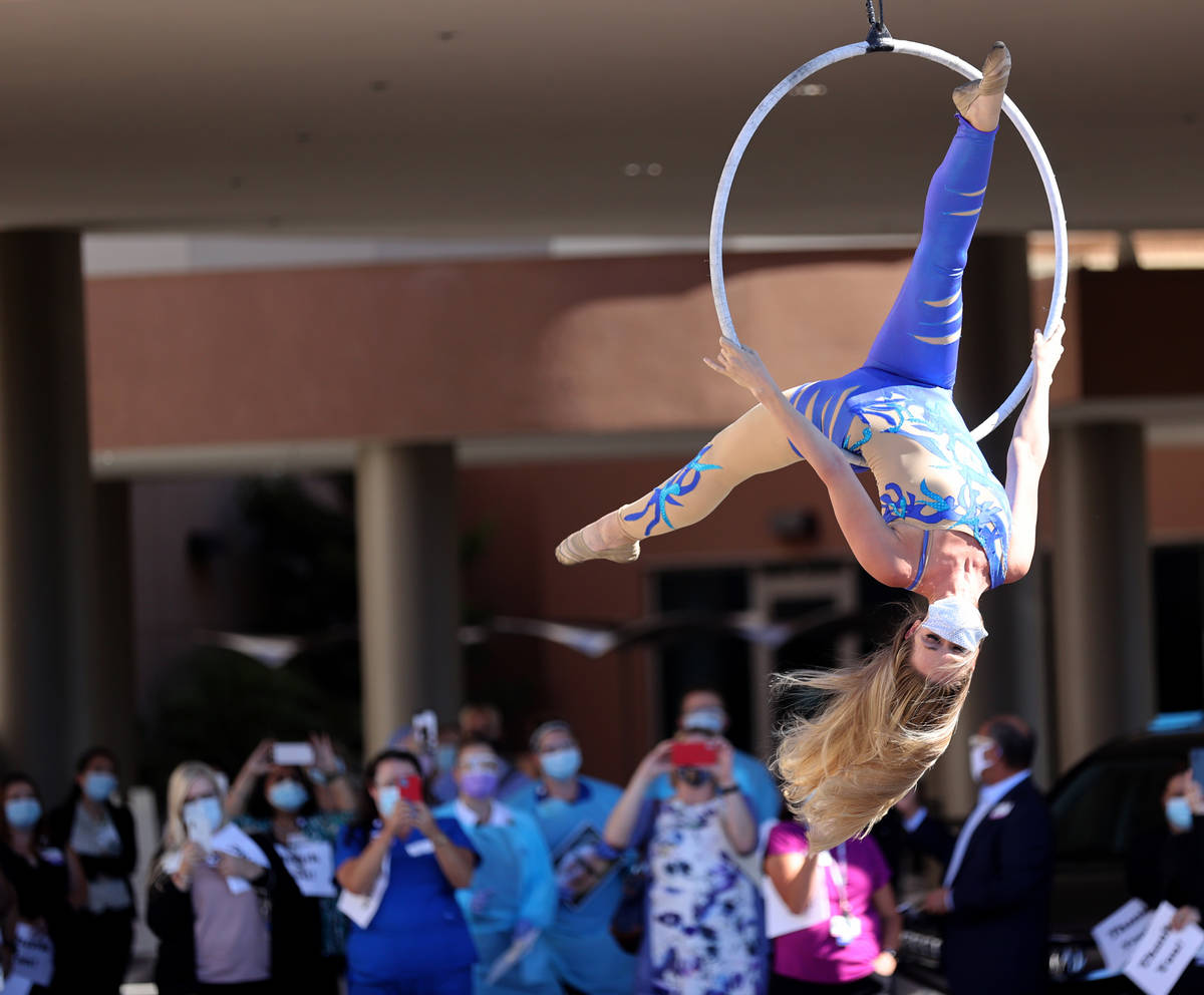 Aerialist Alyssa McCraw performs a #MaskUpNV show for medical professionals at Spring Valley Ho ...