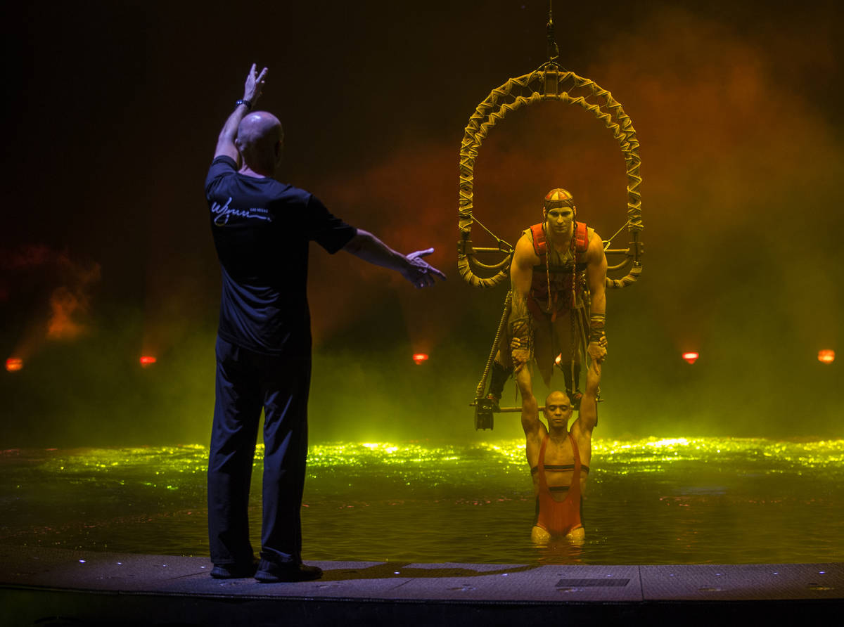 Aerial conceptor, coach and performer Didier Antoine, left, gives direction to Ryan Bartlett, t ...