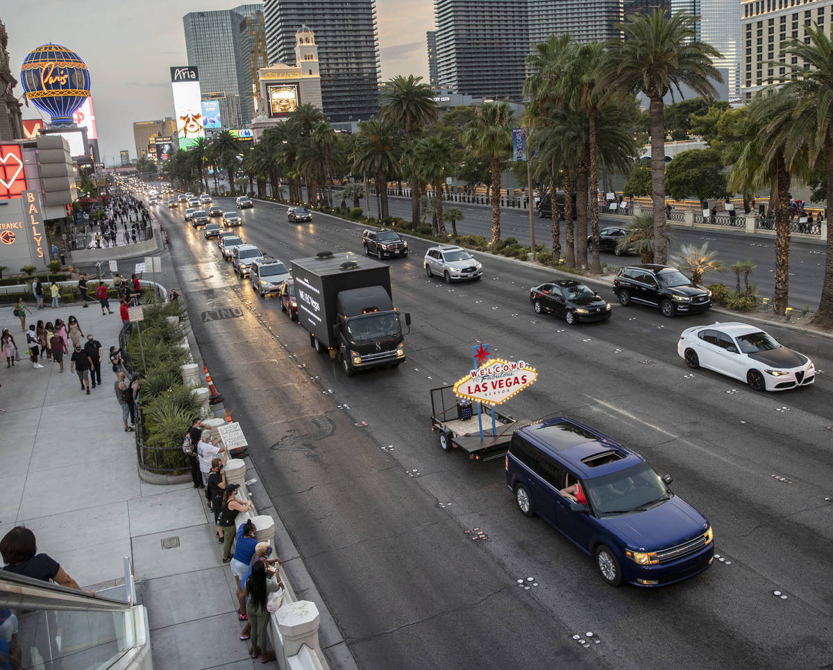 A motorcade of entertainment workers drive south on the Strip during an event to raise awarenes ...