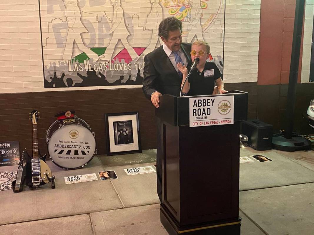 Paul Casey and his son, George, are shown at a rededication event celebrating The Beatles on Fr ...