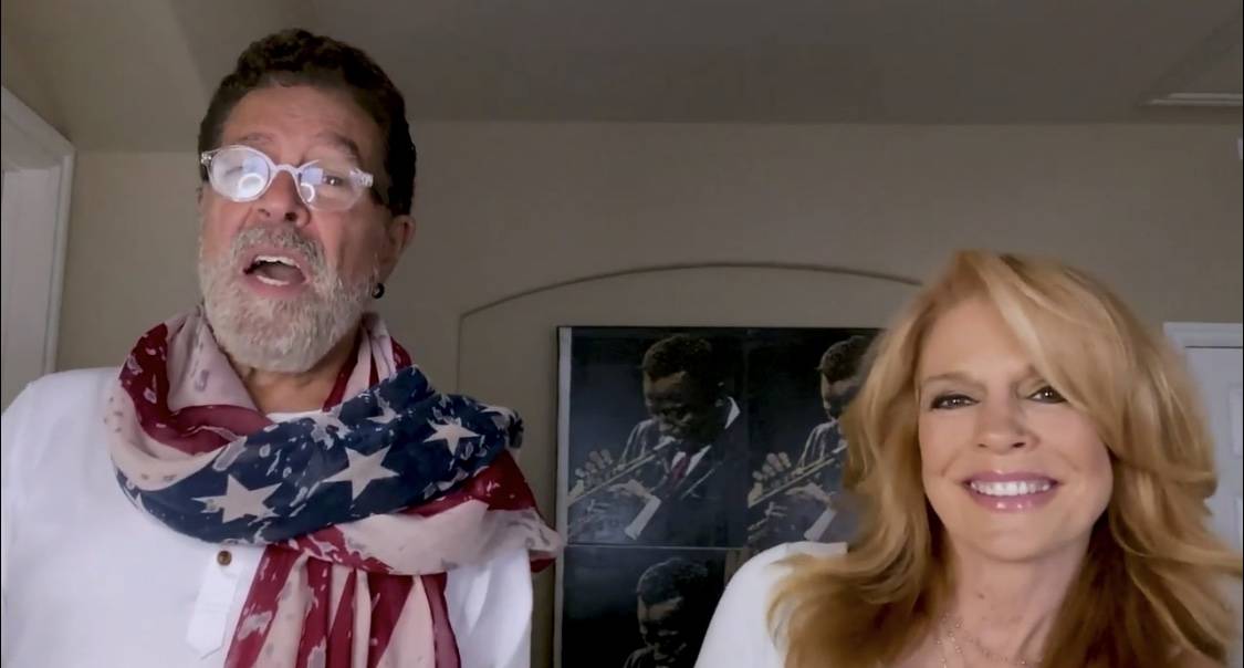 Clint Holmes and Kelly Clinton-Holmes are shown in singing in the "Someday We'll Be Together" v ...