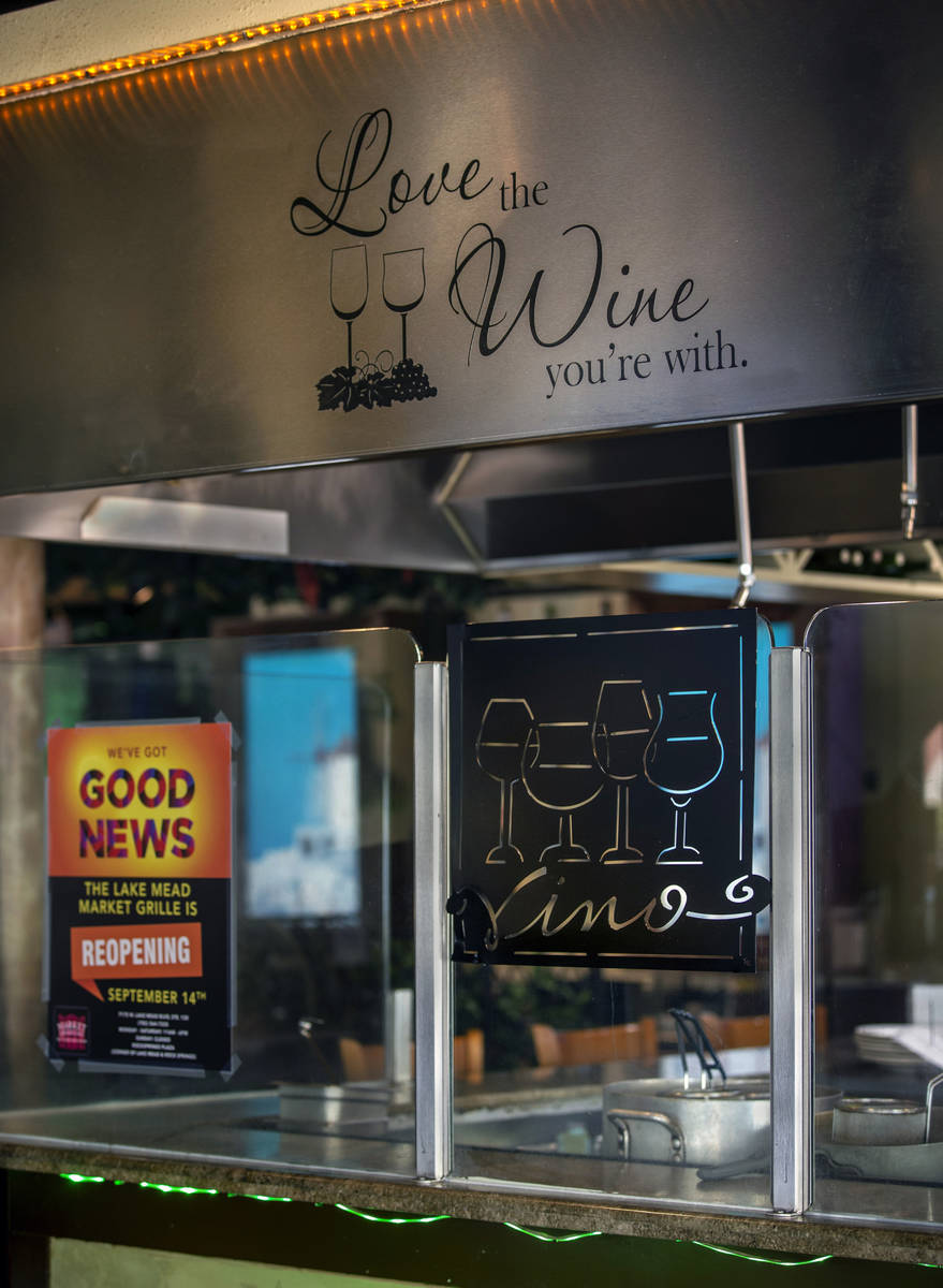 A grill in the center of the restaurant is stylishly closed in with glass at the Market Grille ...
